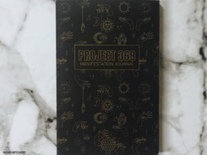 Black Manifestation Journal with the Sun and Moon in Gold