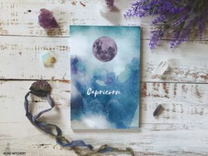 Capricorn lined journal with blue, purple and white watercolor cover